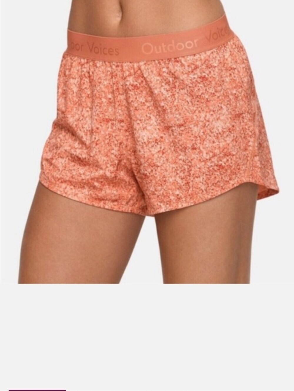 Outdoor Voices Relay shorts featuring a pebbled red patterned design